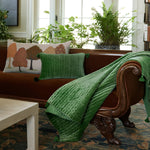 A limited edition Autumn Orchard Bolster by John Robshaw in a living room, meticulously crafted by skilled artisans featuring a hand painted pillow. - 30399930859566