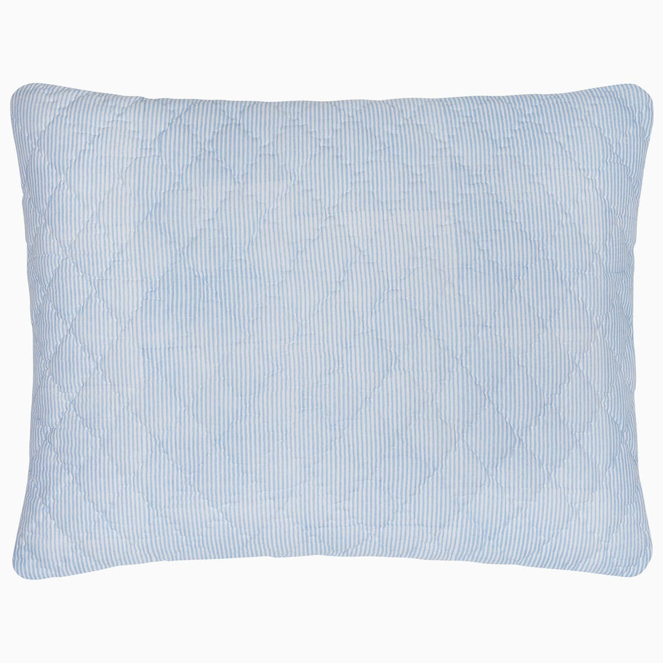 A Nandi Light Indigo Quilted Pillow on a white background, made with cotton voile, by John Robshaw.