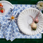 A set of Bhavin Light Indigo Napkins (Set of 4) by John Robshaw, featuring a plate of radishes, inspired by India. - 30800054616110