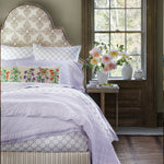 A lavender bedroom with a Bindi Lavender Organic Sheet Set bed and John Robshaw organic pillows. - 30784335446062