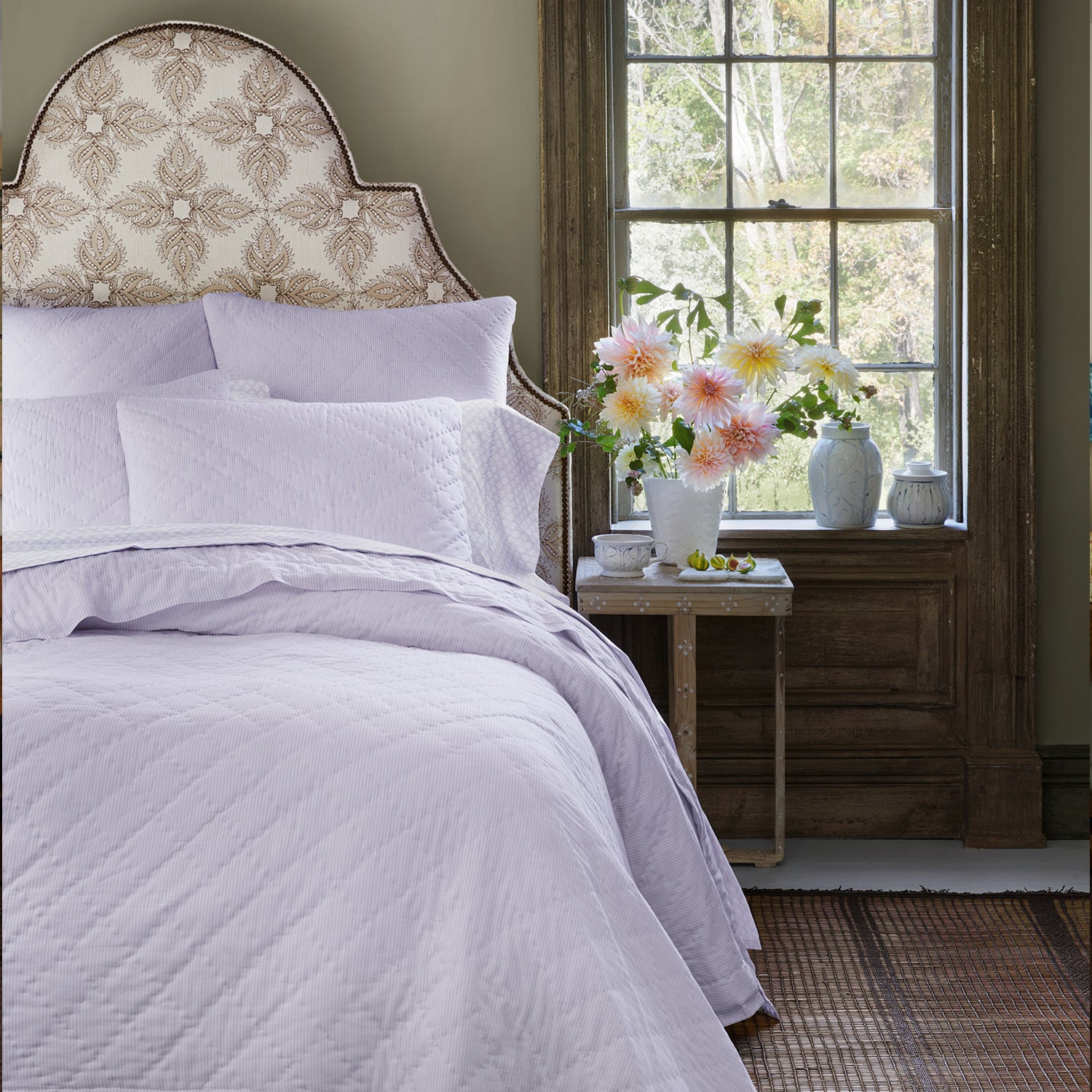 A Nandi Lavender Quilted bed with John Robshaw lavender pillows.