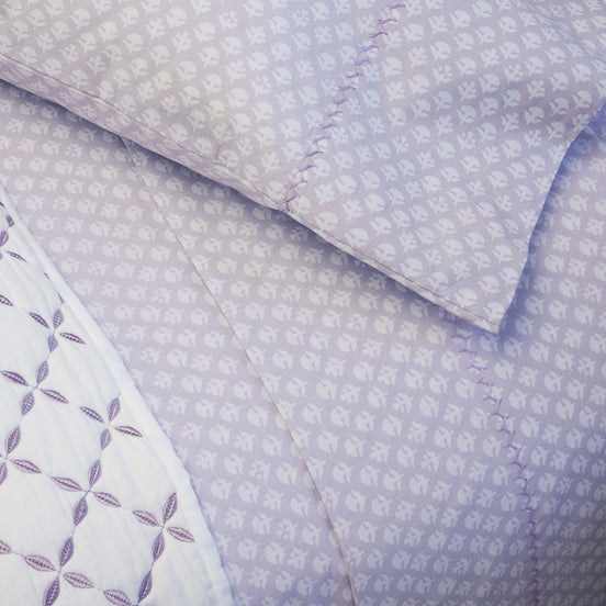 A close up of a Bindi Lavender Organic Sheet Set by John Robshaw.