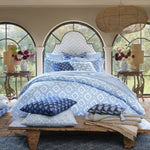 A bedroom with blue and white geometric pattern Girik Decorative Pillow bedding and John Robshaw pillows made of cotton linen. - 30801449222190