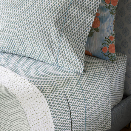 A Cala Sage Organic Sheets bed sheet with a blue and white pattern. (John Robshaw)