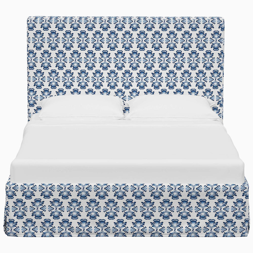A Shona bed by John Robshaw with a blue and white damask fabric pattern.