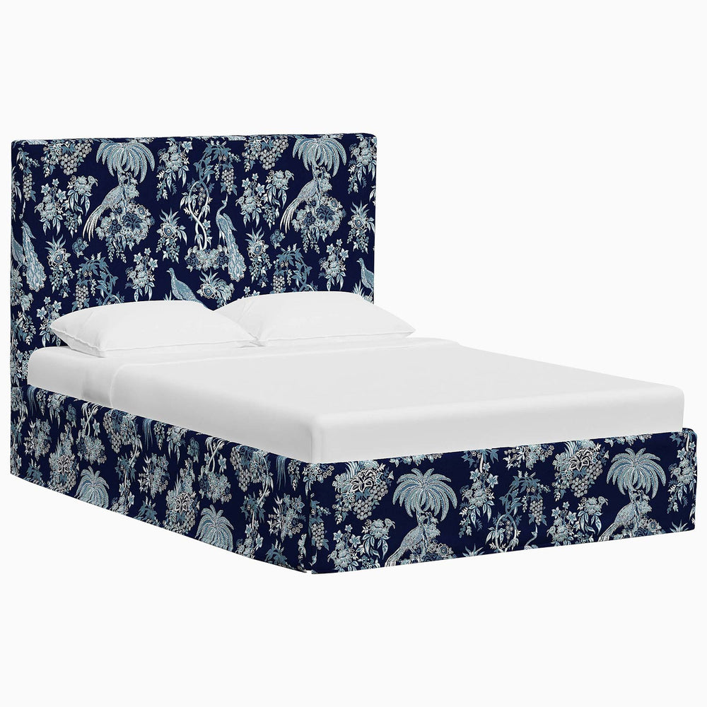 A Shona bed with a blue floral John Robshaw upholstered headboard.