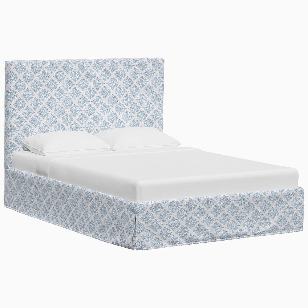 A John Robshaw Shona Bed with a blue and white pattern made of fabrics.