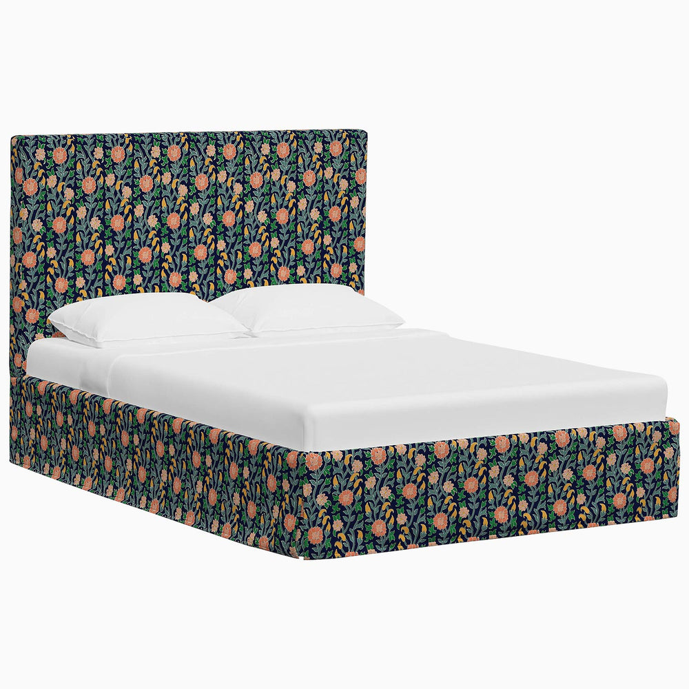A Shona Bed from John Robshaw with floral prints upholstered headboard and footboard.