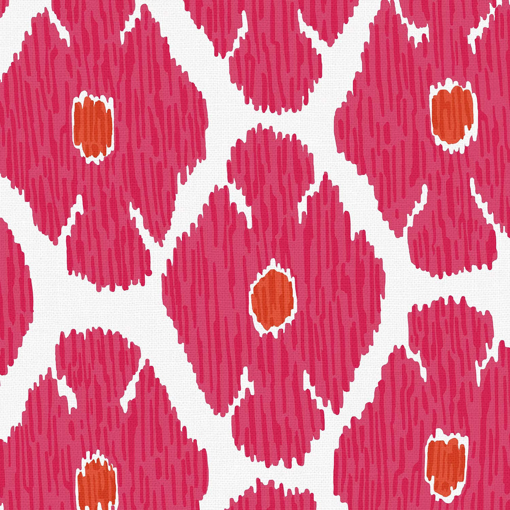 A John Robshaw Shona Bed fabric with a pink and orange ikat pattern on a white background.