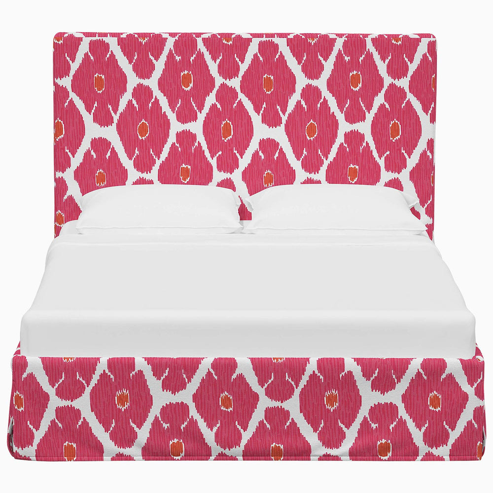 A Shona Bed with John Robshaw prints on a pink and white patterned cover.