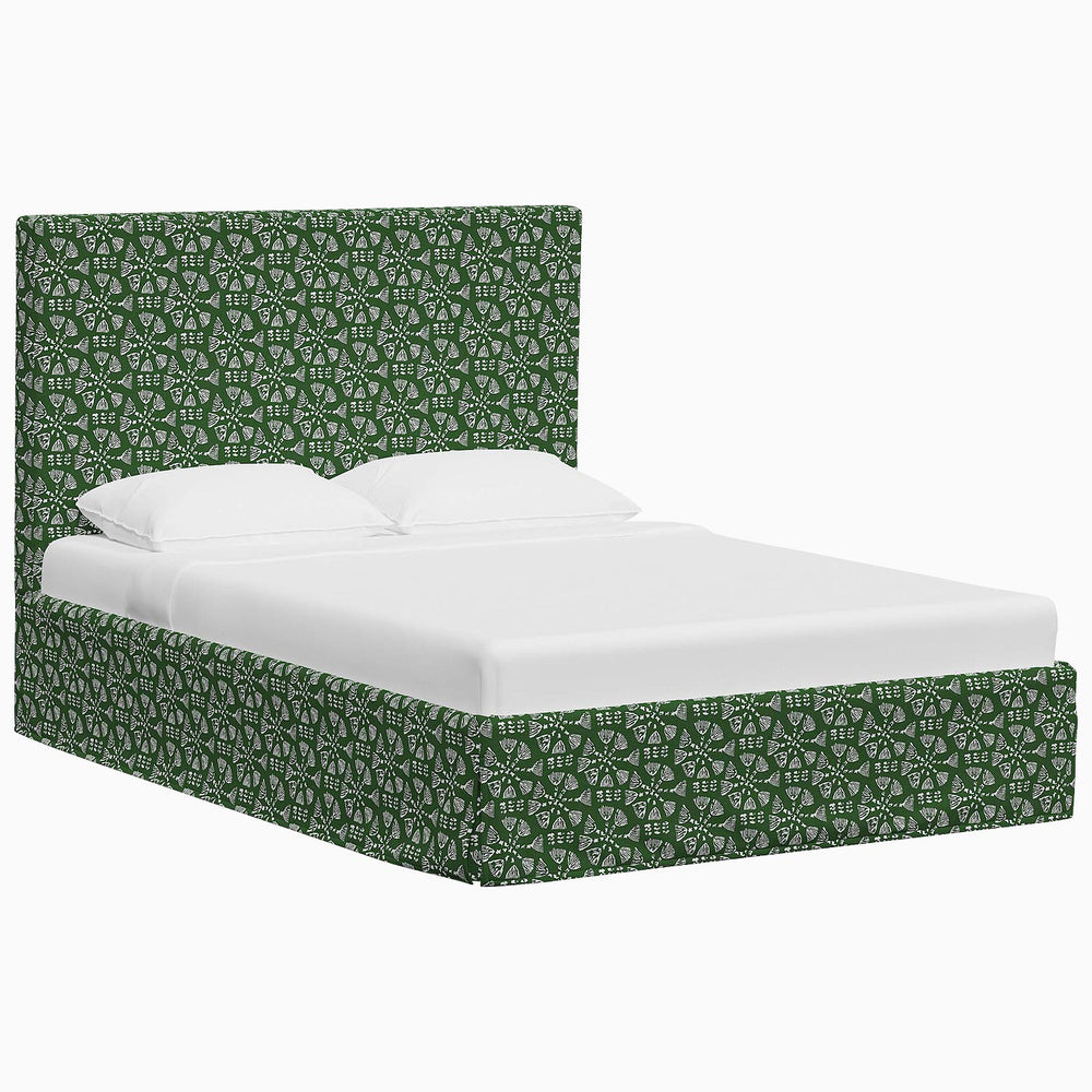 A green upholstered Shona Bed in John Robshaw fabric with a white headboard.