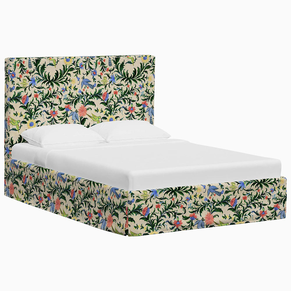 A Shona Bed with a tropical print headboard and footboard made from John Robshaw fabrics.