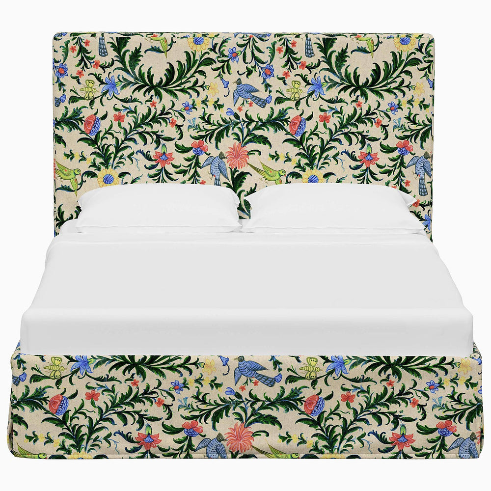 A John Robshaw Shona Bed with floral prints on its fabrics.