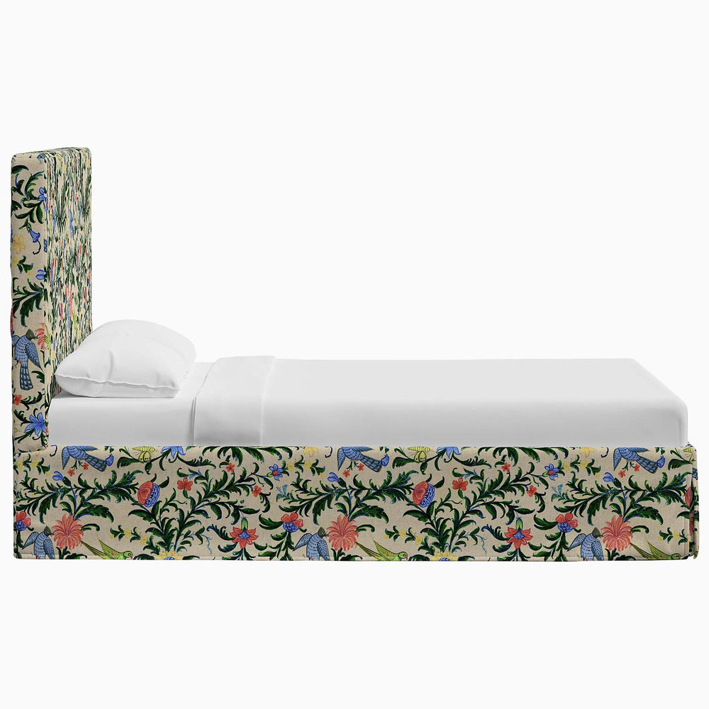 A Shona Bed with a John Robshaw-print upholstered headboard and footboard.