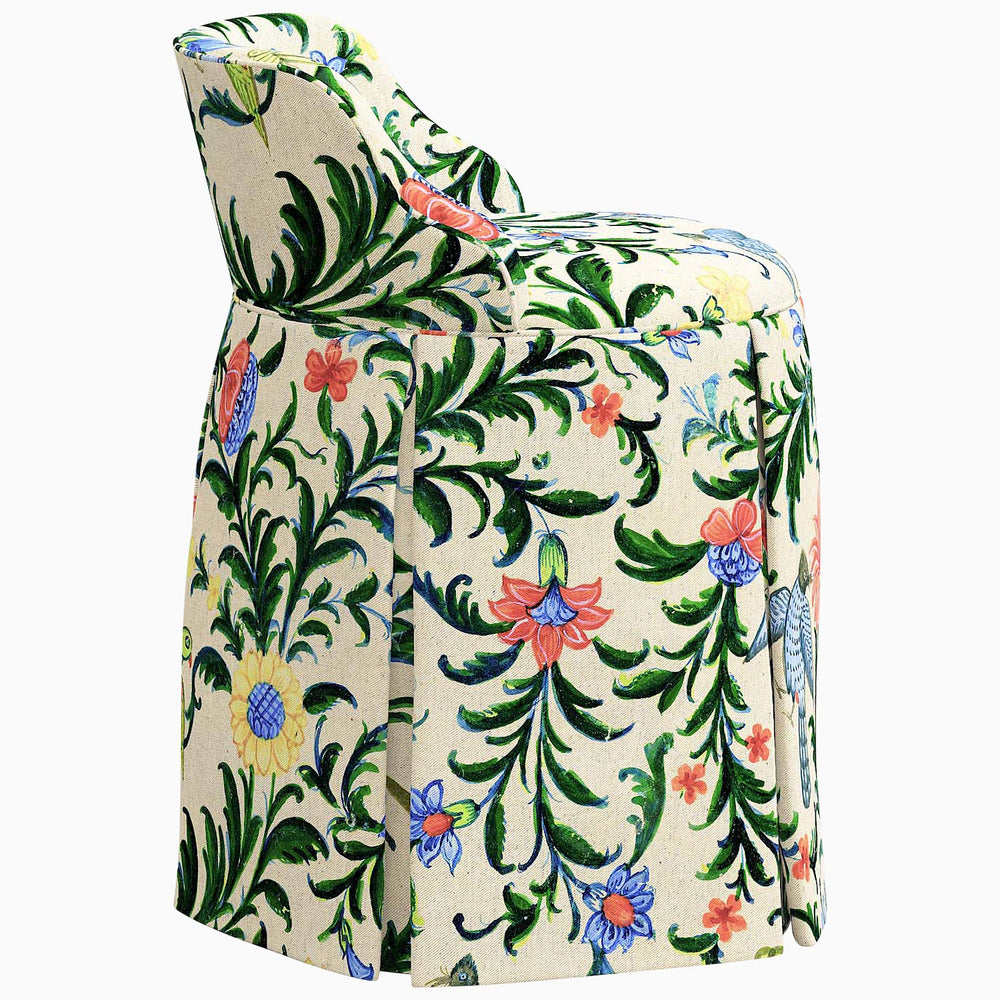 An elegant Meha Vanity Chair with a floral pattern on exclusive fabrics by John Robshaw.