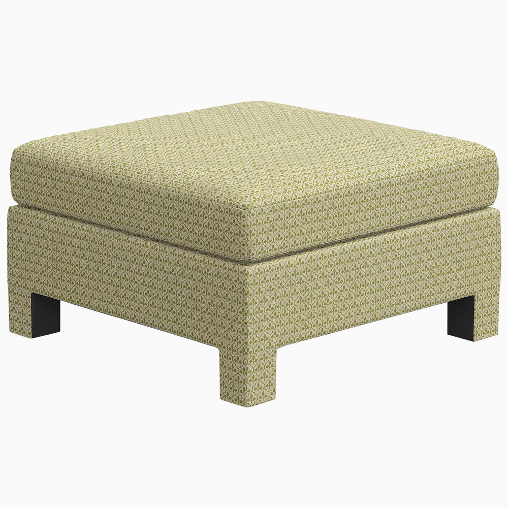 An exclusive Sameera Ottoman with a wooden base, made to order, by John Robshaw.