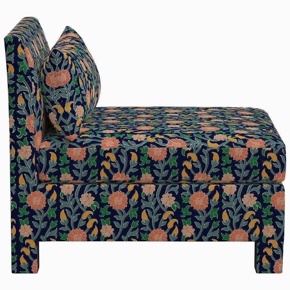 The John Robshaw Sameera Armless Chair features an exclusive floral pattern on its upholstery, creating a unique and stylish seating arrangement.