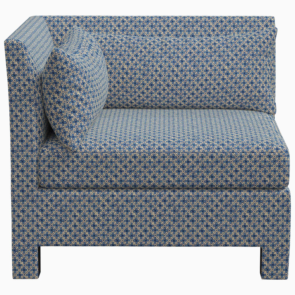 The John Robshaw Sameera Corner Chair features exclusive fabrics and showcases a striking blue color.