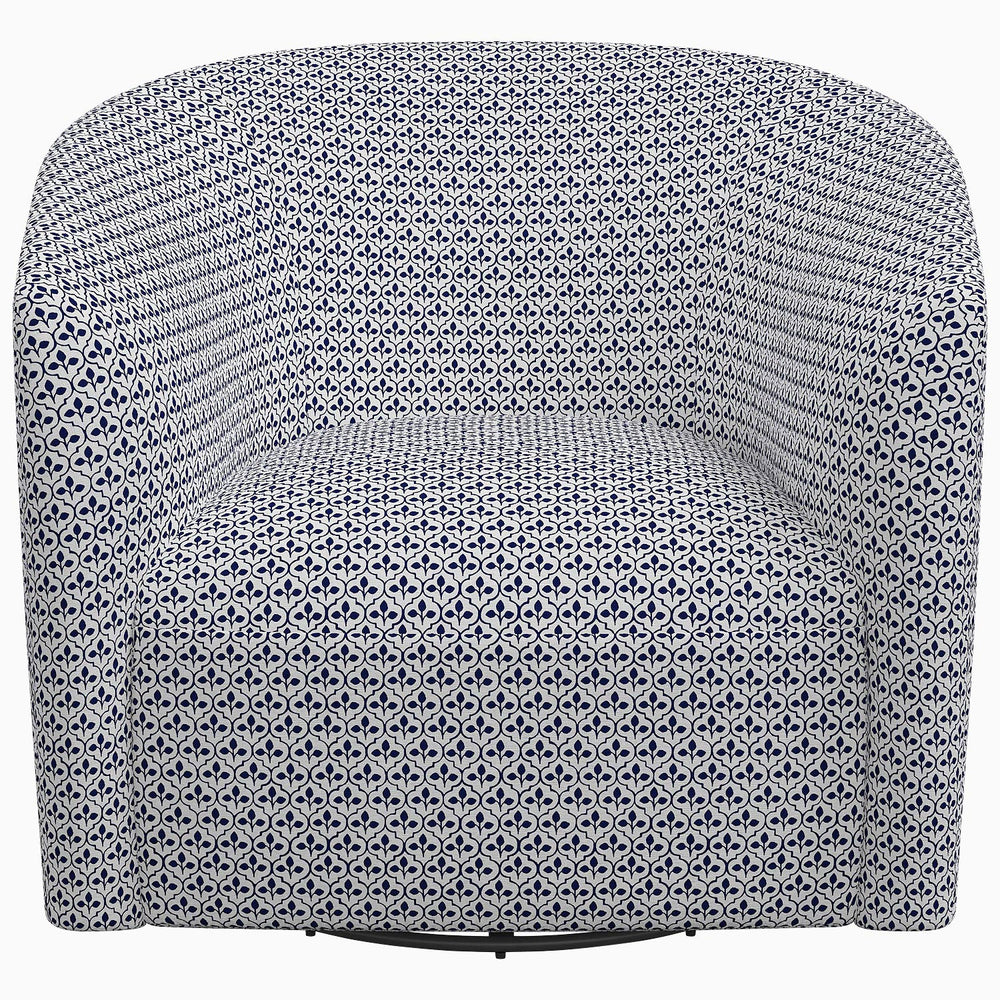 The Amrit Swivel Chair by John Robshaw has a blue and white print.