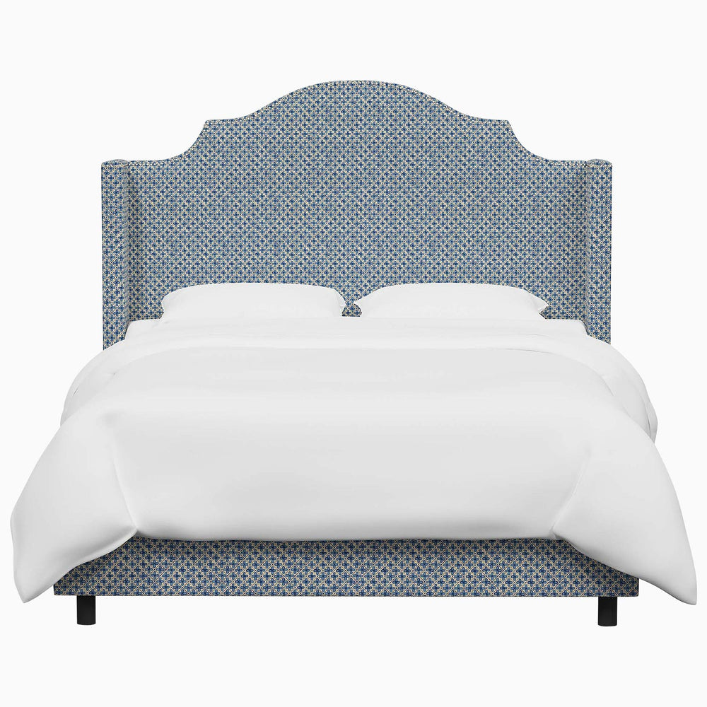 The John Robshaw Samrina Bed features a blue upholstered headboard with Mughal arches.