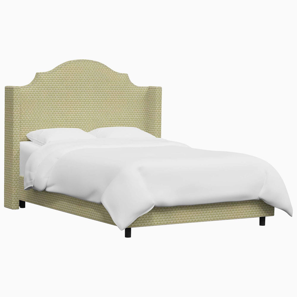 A Samrina Bed with a green headboard featuring Mughal arches from John Robshaw.