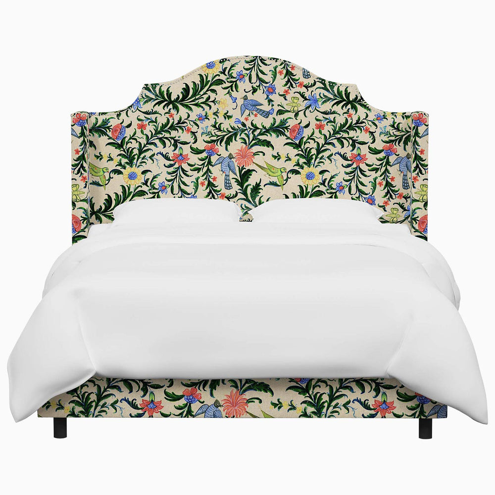 The John Robshaw Samrina bed features a floral upholstered headboard and footboard, exuding an elegant charm.