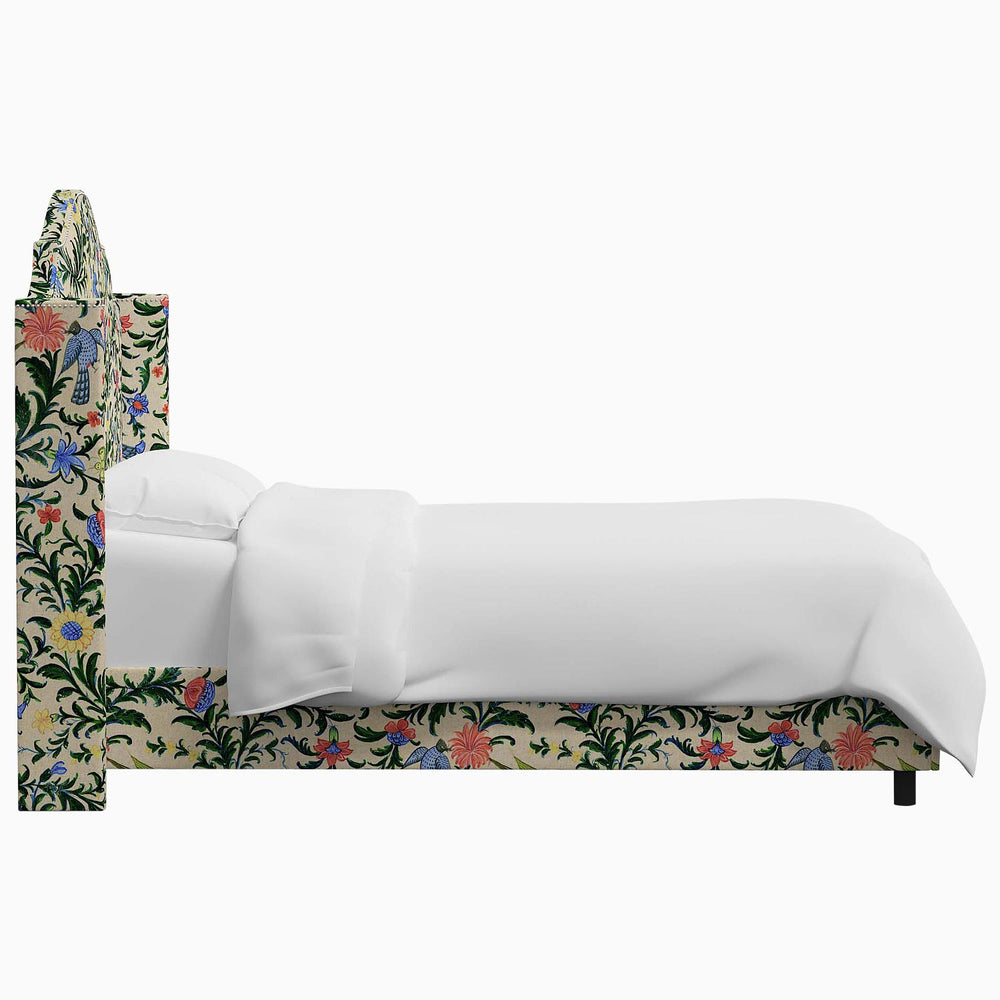 The John Robshaw Samrina bed features a floral upholstered headboard inspired by Mughal arches.