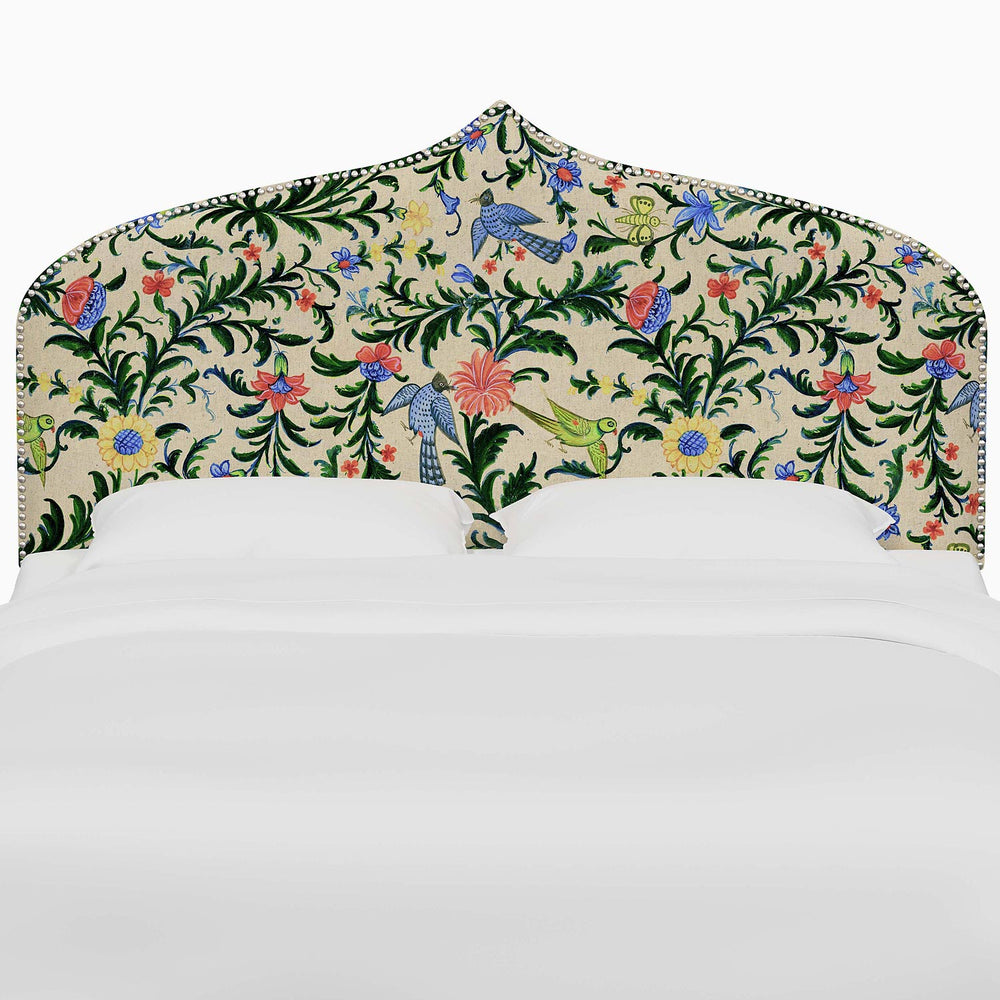 A bed with an Alina Headboard by John Robshaw