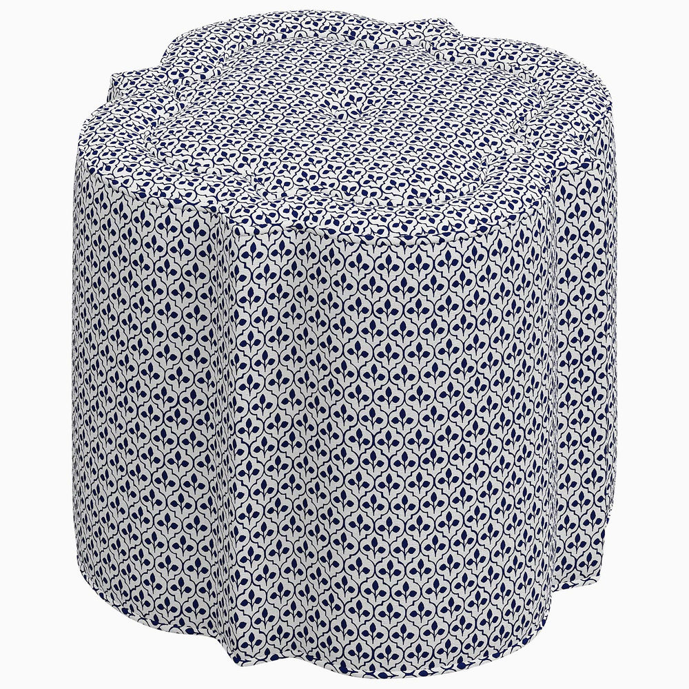 A Skyline Shiza Ottoman, a blue and white patterned stool inspired by Kashmir gardens on a white background.