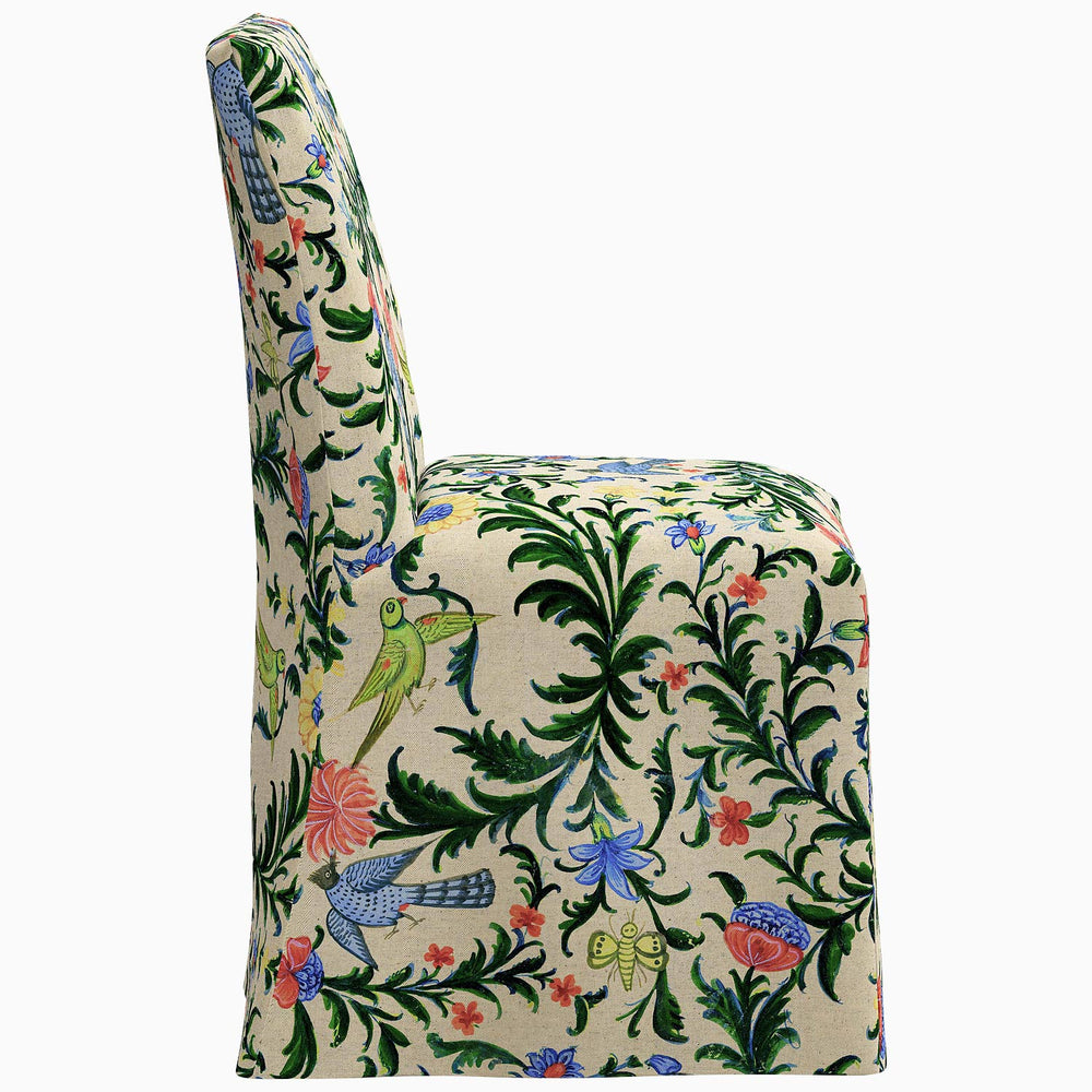 The John Robshaw Sadia Slipcover Chair, with a delightful floral pattern, is a stylish option for any dining chair.
