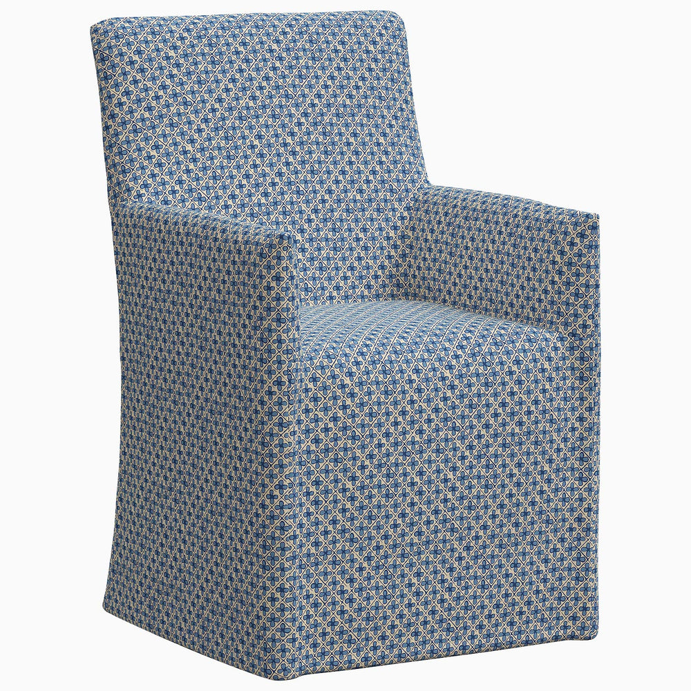 An exclusive John Robshaw Rekha Slipcover Dining Chair with a geometric pattern.