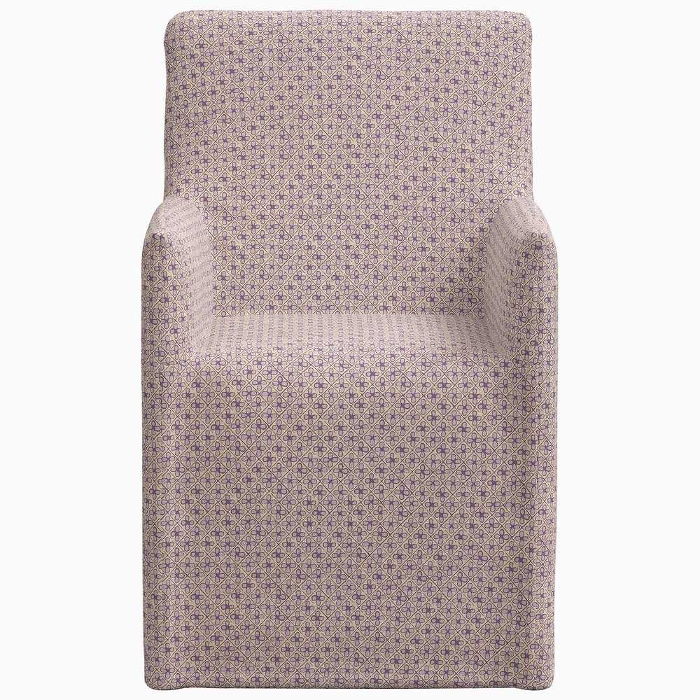 The John Robshaw Rekha Slipcover Dining Chair features exclusive prints, including a purple polka dot pattern.