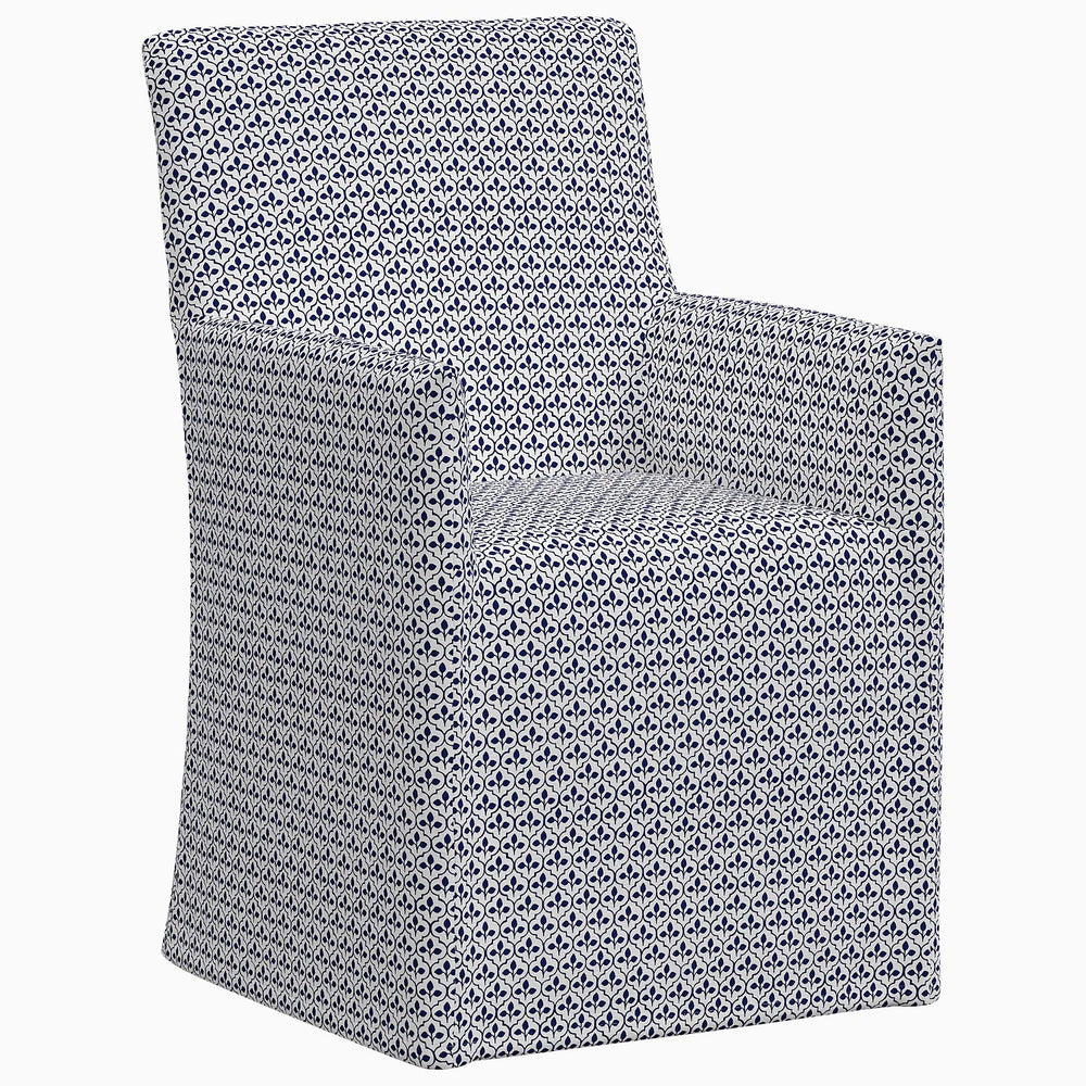 The exclusive prints of the John Robshaw Rekha Slipcover Dining Chair showcases a blue and white geometric pattern.