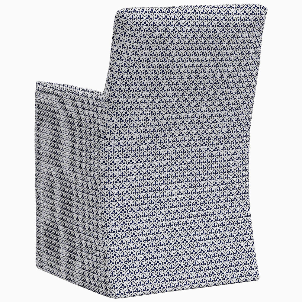 The back of a Rekha Slipcover Dining Chair featuring an exclusive blue geometric pattern by John Robshaw.