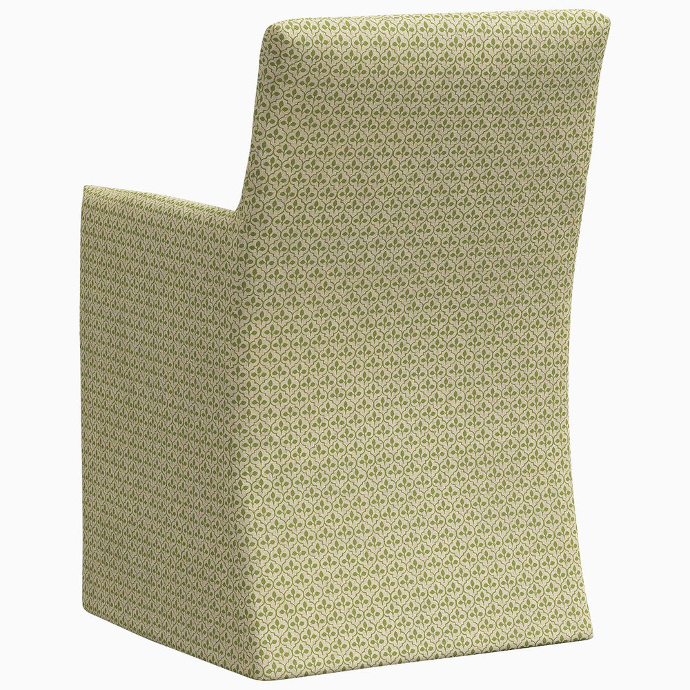 The back of a John Robshaw Rekha Slipcover Dining Chair, featuring an exclusive print and upholstered in green fabric.