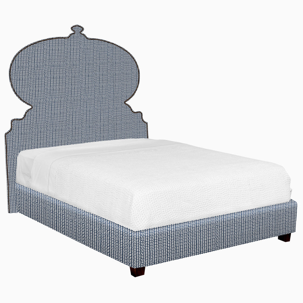 A blue Custom Orissa Bed with a headboard and footboard for white glove delivery by John Robshaw.