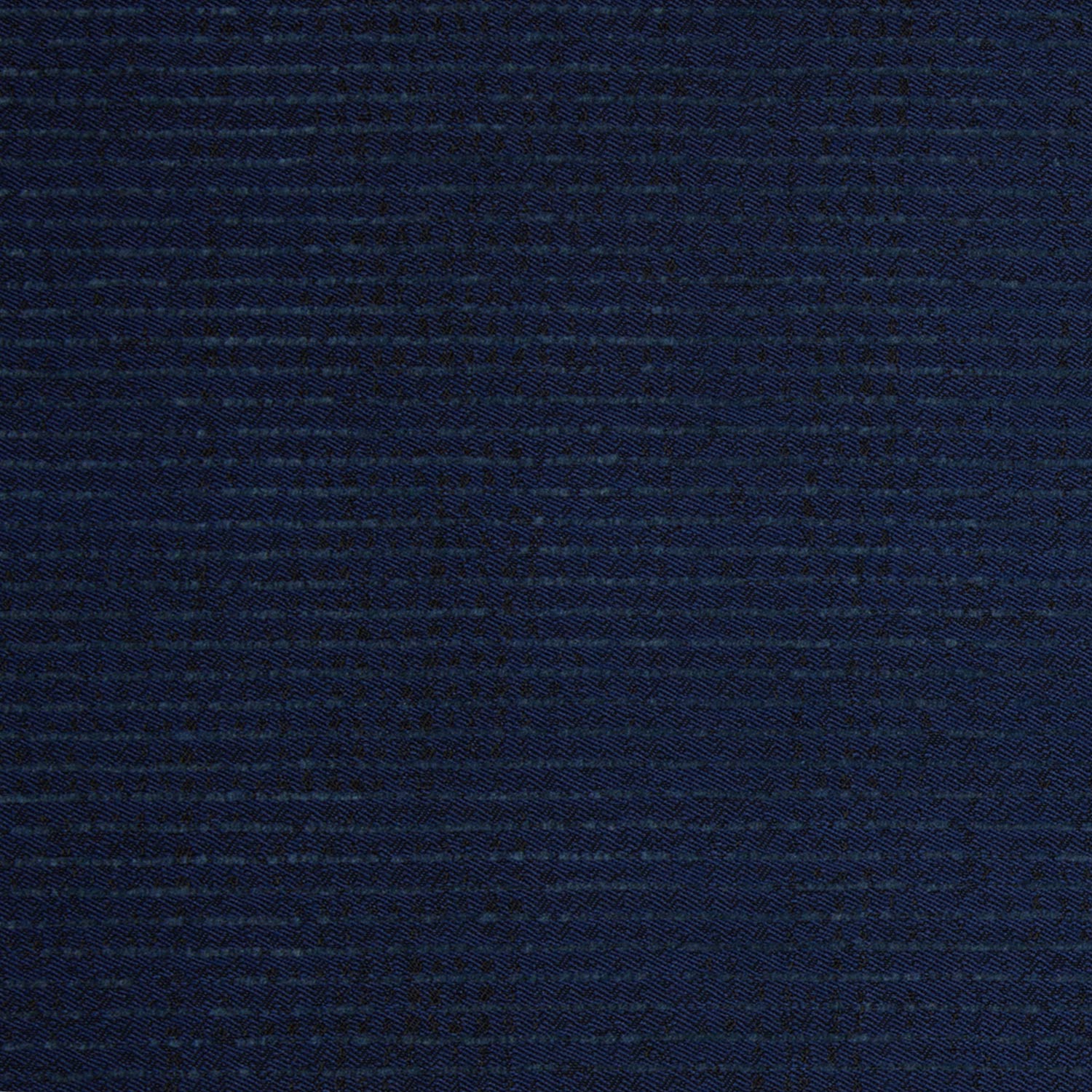 A close up image of a dark blue John Robshaw Bijal Indigo Performance Fabric suitable for indoor and outdoor use.