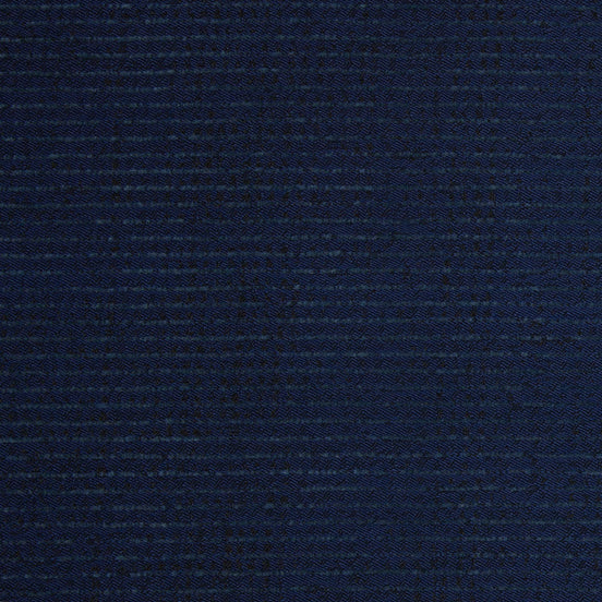 A close up image of a dark blue John Robshaw Bijal Indigo Performance Fabric suitable for indoor and outdoor use.