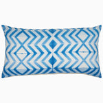 A unique blue and white Shibori printed Pari Bolster pillow on a white linen background by John Robshaw. - 30793432498222