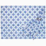 A set of Bhavin Light Indigo Napkins (Set of 4) by John Robshaw with a printed floral pattern. - 30797162512430
