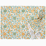 A Juri Sage Placemat (Set of 4) made by John Robshaw, featuring an orange and green floral design on a crisp white background, and hand block printed from 100% cotton. - 30797219823662