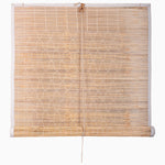 The Bamboo Chik Blinds by John Robshaw Textiles, showcasing an Indian chik design and simple woven pattern, hang rolled-up with a center cord. - 31884735381550