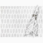 A hand printed grey and metallic gold Lia Silver Napkin (Set of 4) placemat with a white cotton slub napkin. (Brand: John Robshaw) - 30405249433646