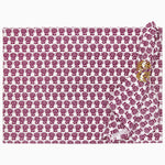 A Navya Berry placemat by John Robshaw, printed pink and white cotton with skulls on it. - 30405247467566