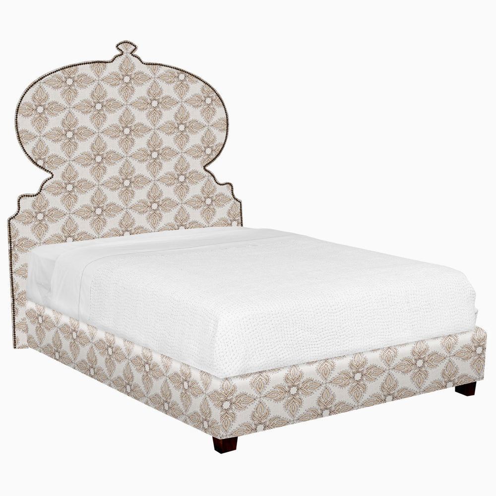 A patterned John Robshaw bed with a white glove delivery option for shipping.