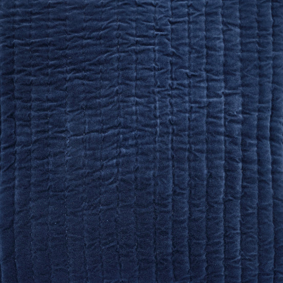 A Velvet Indigo Quilt Swatch pillow hand-quilted by John Robshaw on a white background.