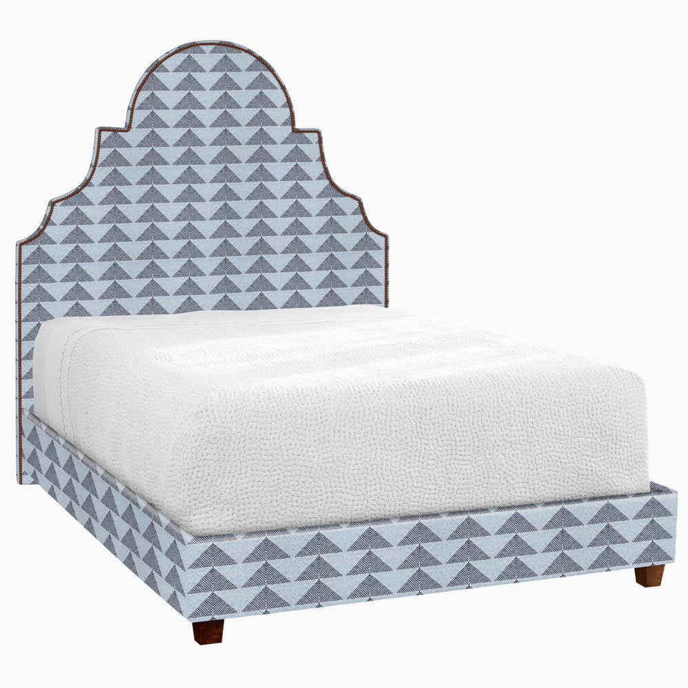 A Custom Dara Bed with a geometric pattern on the headboard and footboard, by John Robshaw, available for shipping.