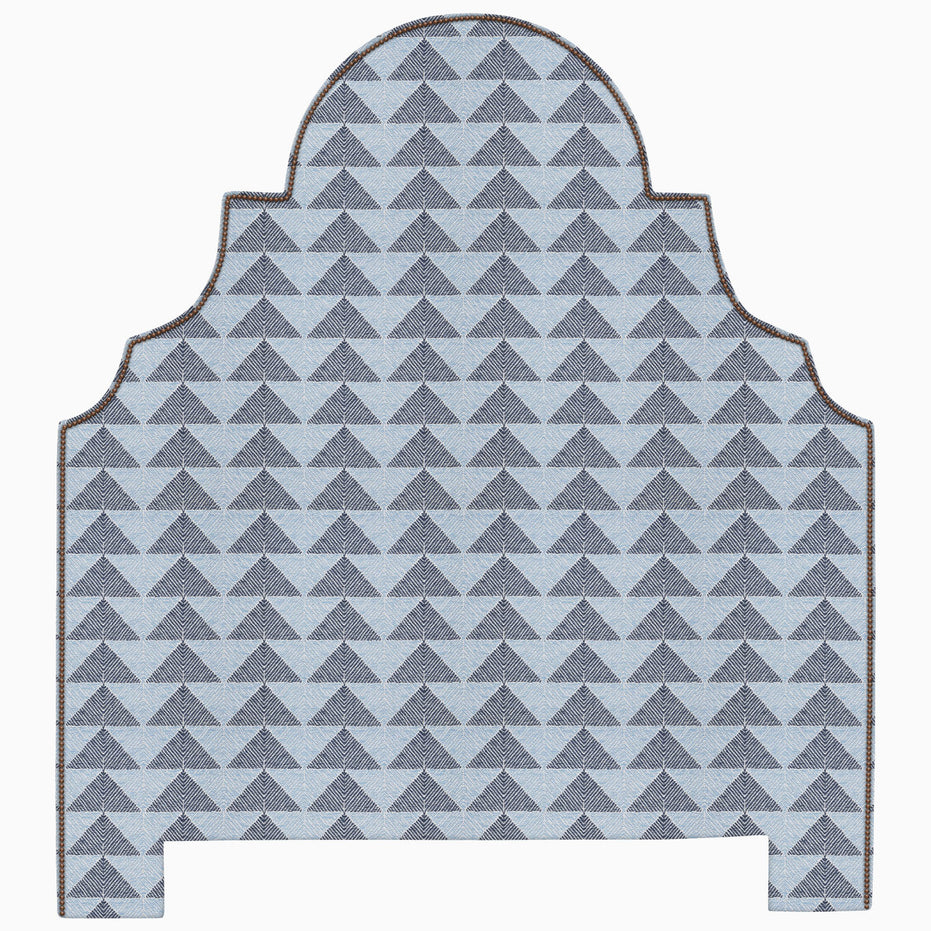 A Custom Dara Headboard with a geometric pattern in blue and gray available for shipping by John Robshaw.