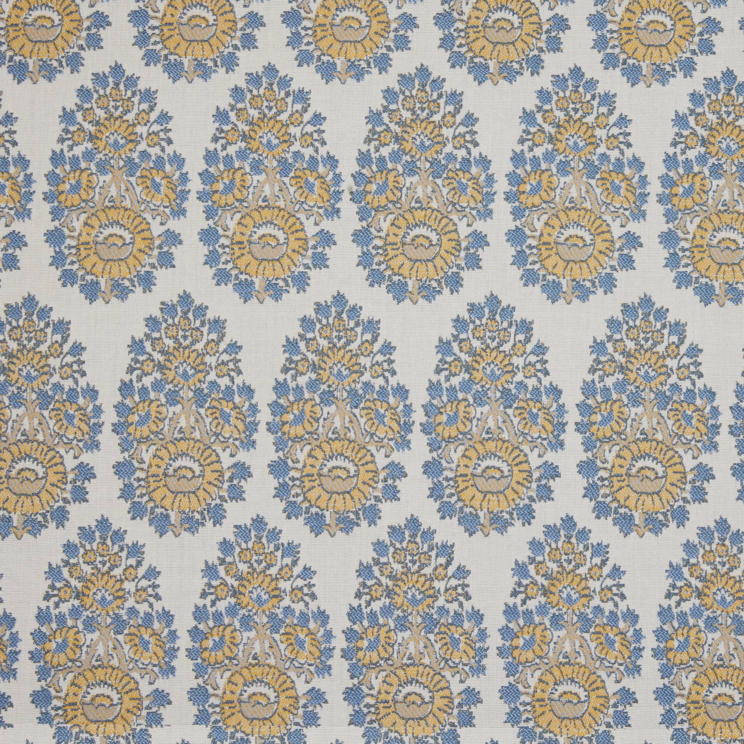 A blue and yellow floral pattern on a white background, featuring block prints, made with Lanka Marigold Performance Fabric by John Robshaw.