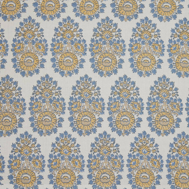 A blue and yellow floral pattern on a white background, featuring block prints, made with Lanka Marigold Performance Fabric by John Robshaw.